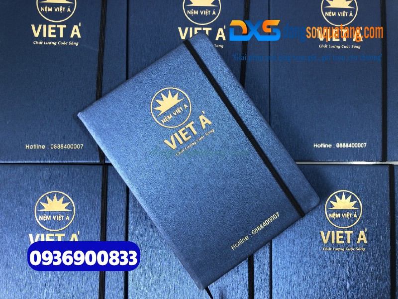 Sổ tay dán gáy màu xanh , kẹp chun , ép kim vàng logo Công Ty Nệm Việt Á 